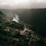 aerial view of city near mountain during daytime